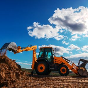 Wheel,Loader,Excavator,With,Field,Background,During,Earthmoving,Work,,Construction